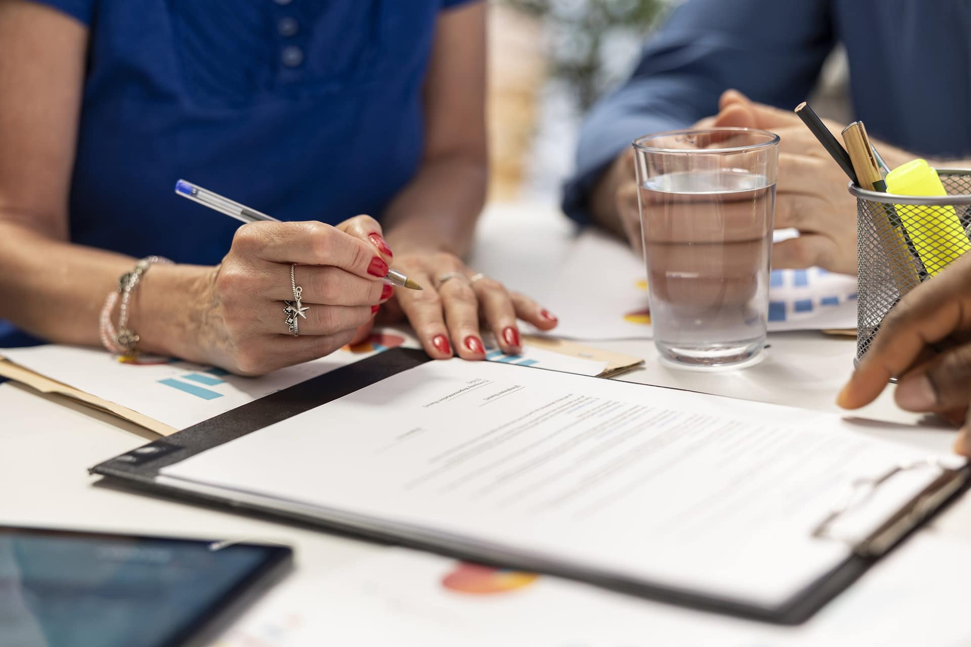Senior woman signing the new retirement plan contract in a meeting Photo by <a href="https://unsplash.com/@stevgol?utm_source=unsplash&utm_medium=referral&utm_content=creditCopyText">Stephen Goldberg</a> on <a href="https://unsplash.com/photos/woman-in-white-shirt-holding-pen-writing-on-white-paper-LBLc9M1YrwQ?utm_source=unsplash&utm_medium=referral&utm_content=creditCopyText">Unsplash</a>